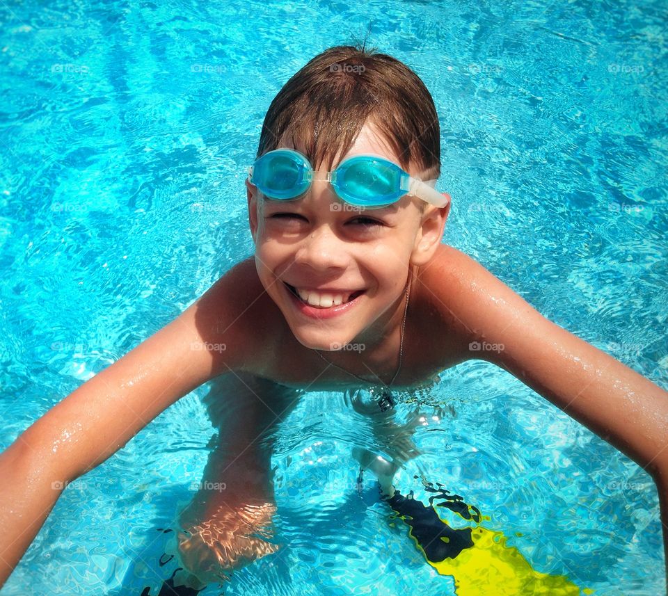 Elevated view of a boy in swimming pool