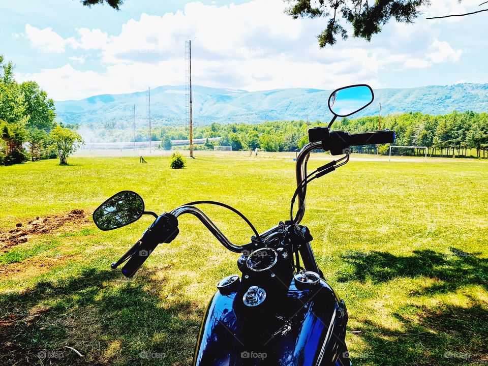 detail of motorcycle on a countryside background