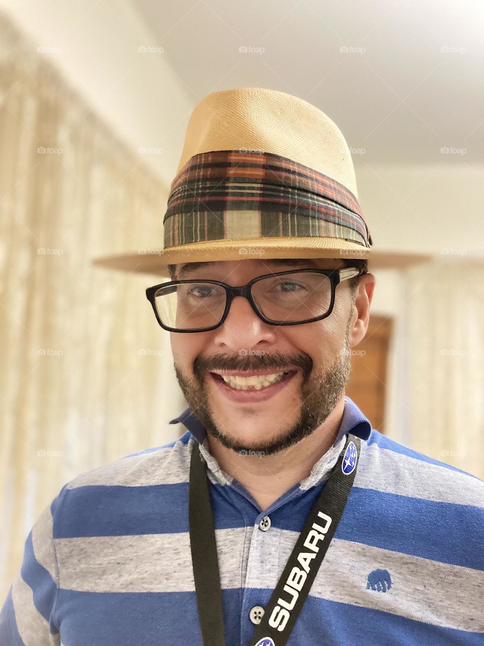 Happiness while smiling in a hat