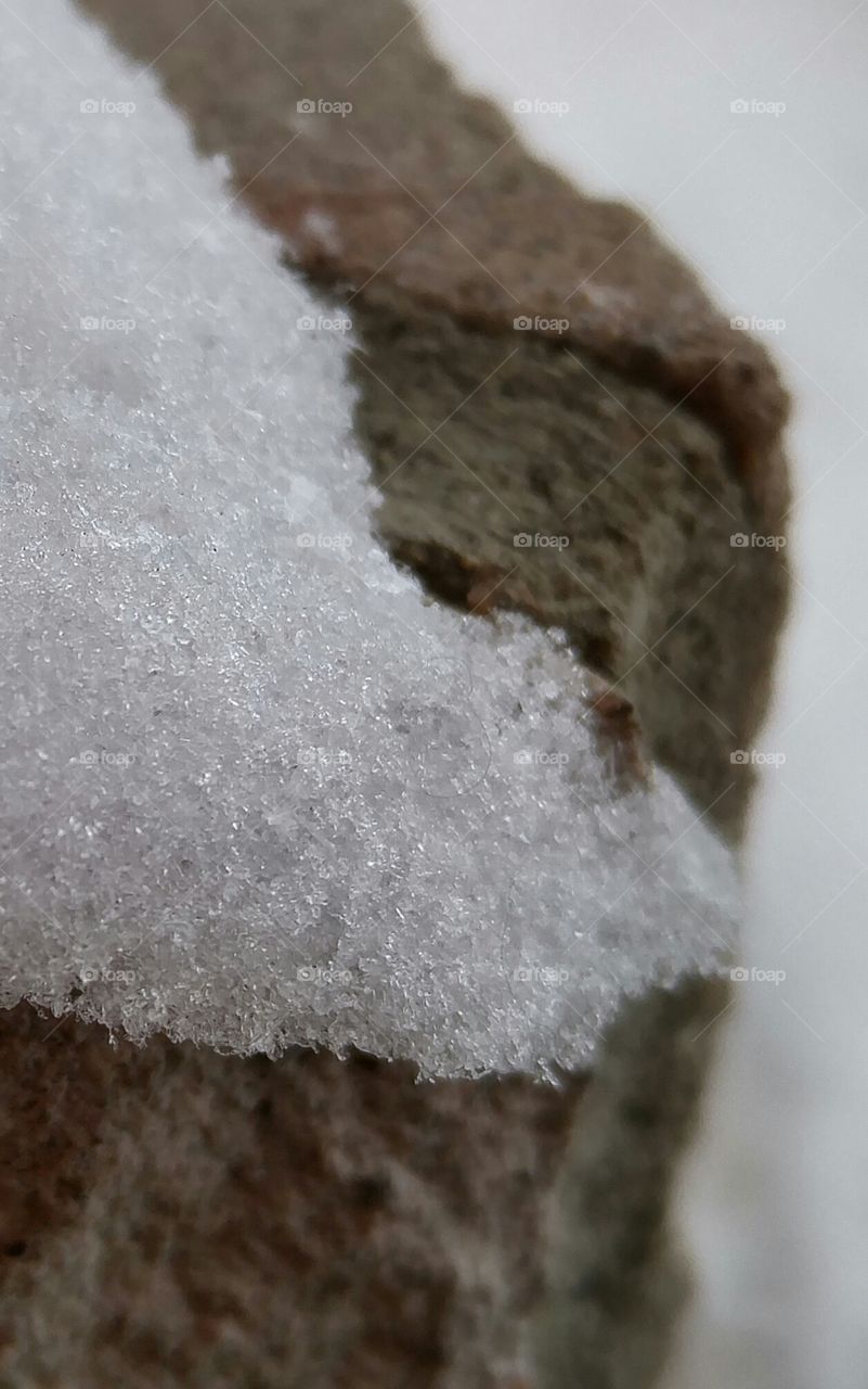 Close up of snow on rocks