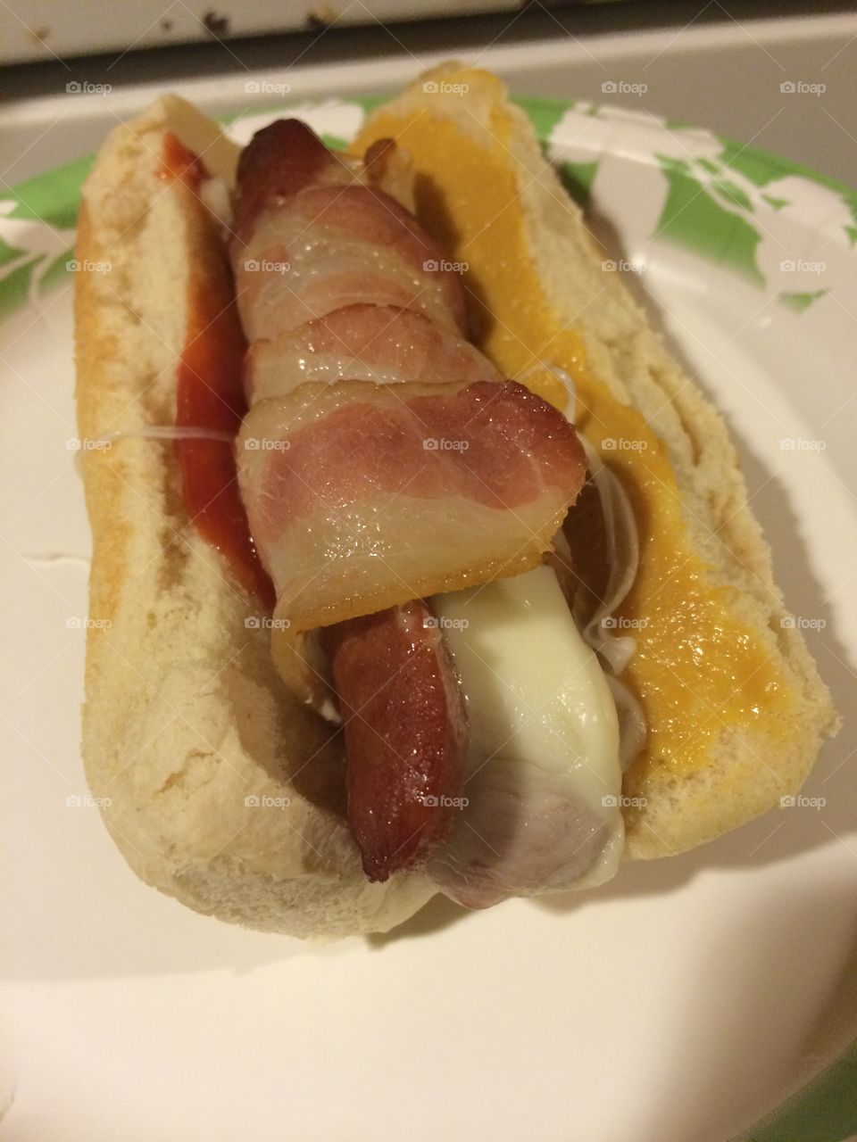 Cheesy stuffed bacon wrapped hotdog 