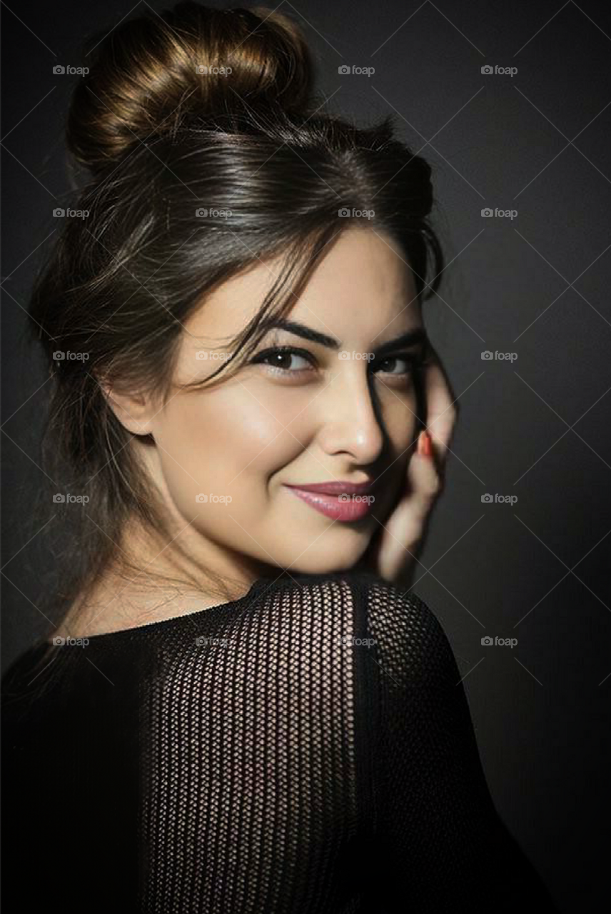 Portrait of a positive woman. Woman turn her head and smiles