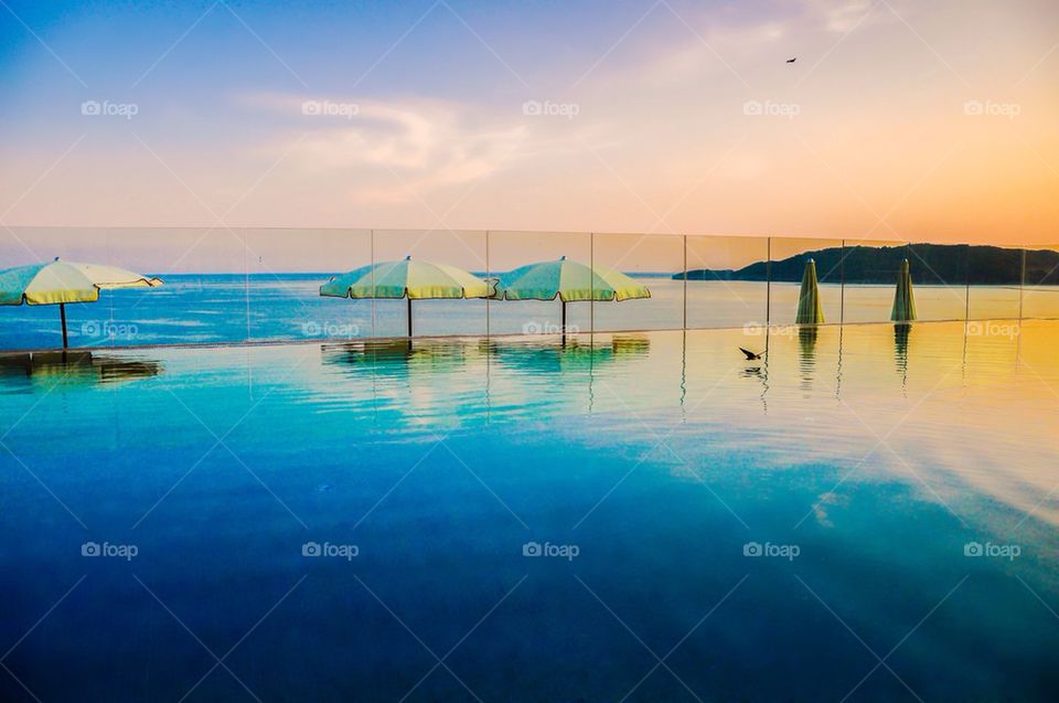 Beach umbrella in swimming pool