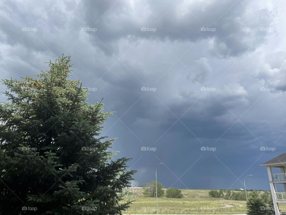 A storm is coming into Medicine Hat, Alberta, Canada, from off the prairies, from the looks of these dark clouds, on this once sunny summer afternoon