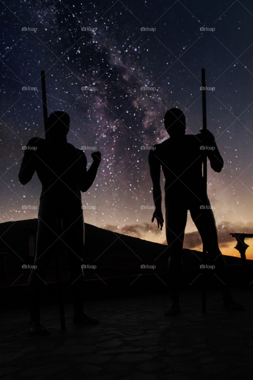 historical fuerteventura statues on milky way sky