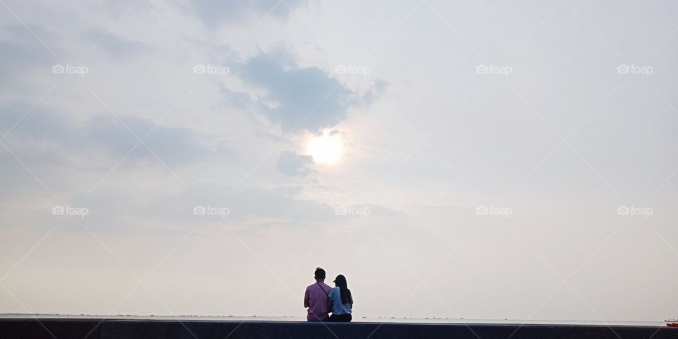 Couple waiting for sunset.