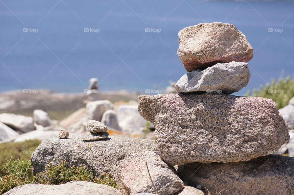 Stacking Stones - stacked stones marking the path to the top of Delos  Island,  Greece.