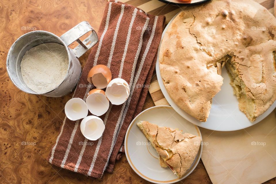 Making homemade puffed apple pie with eggs, sugar and flour.