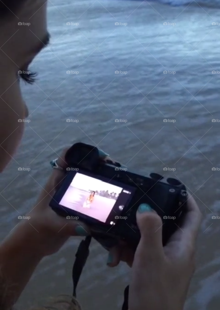 Take a picture of the camera on the beach.