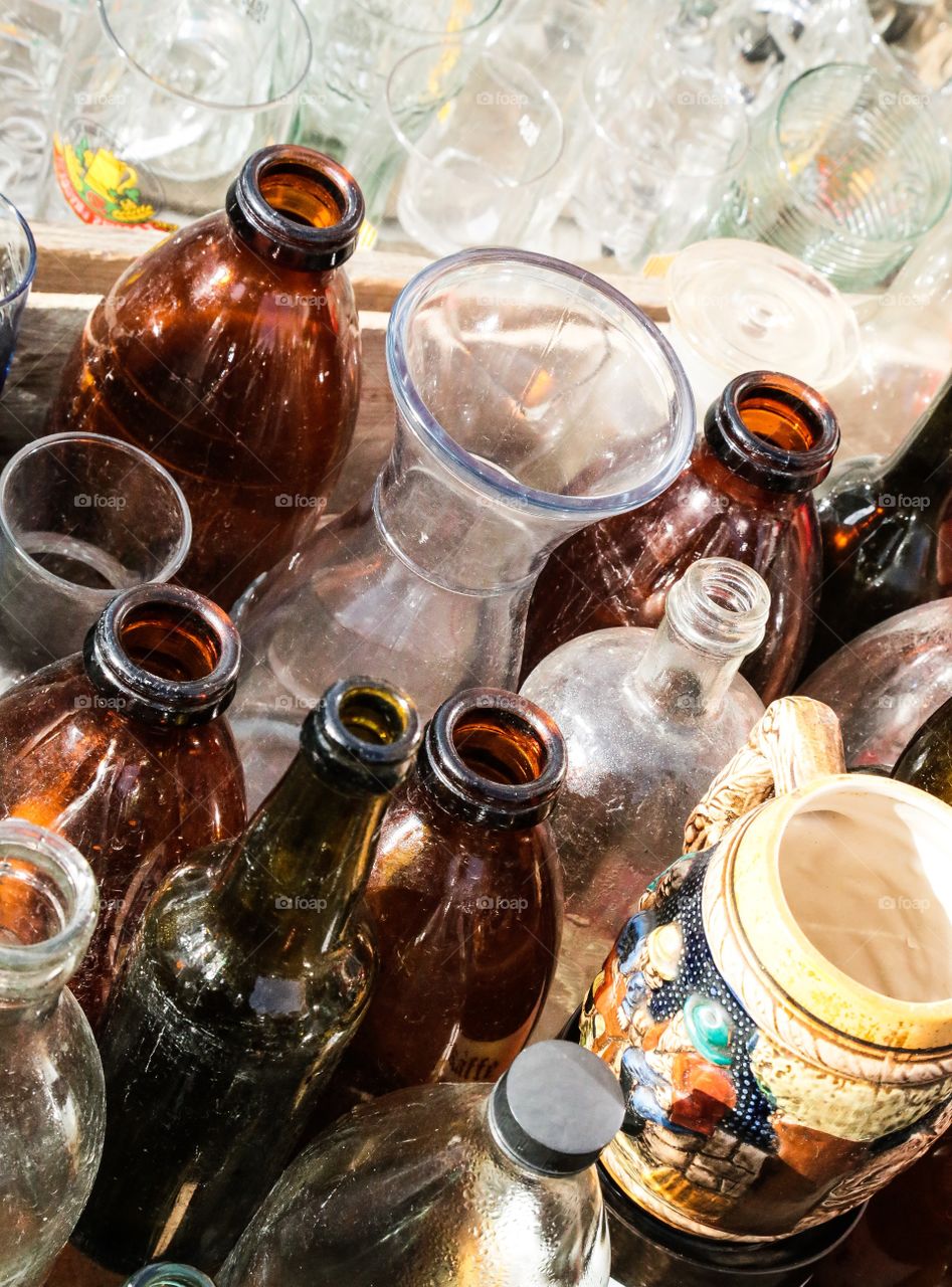 Glass items. Drinking glasses and bottles