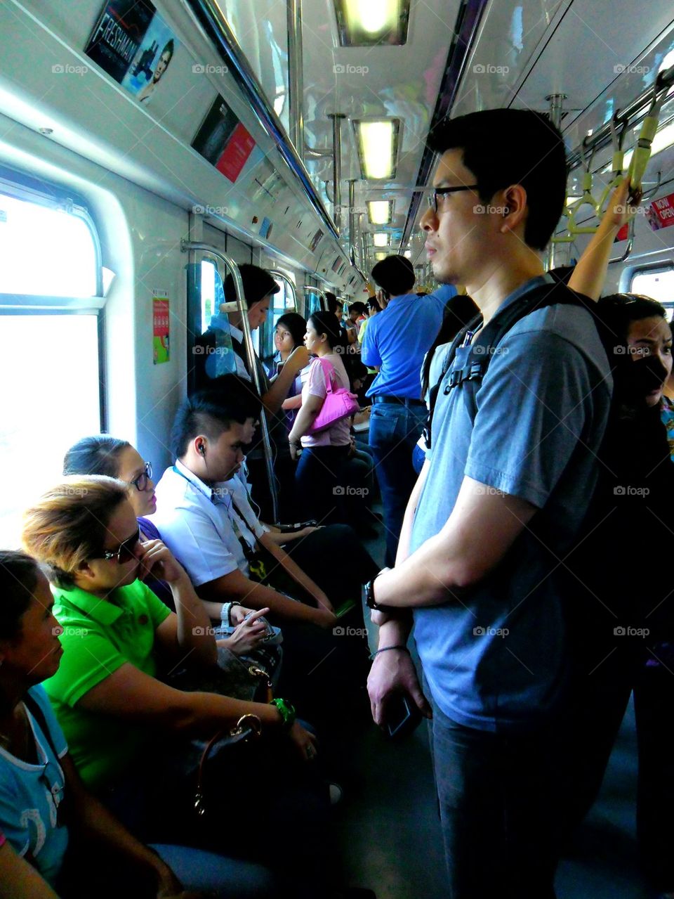 commuters or passengers inside a train coach