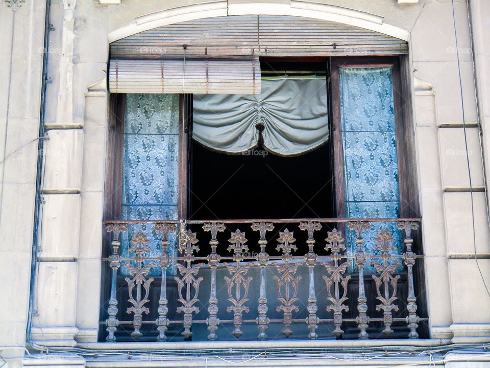 Window with blue curtains 