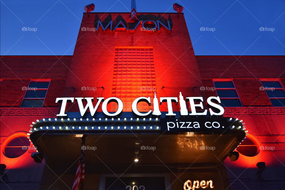 An Art Deco style building highlighted with red lights