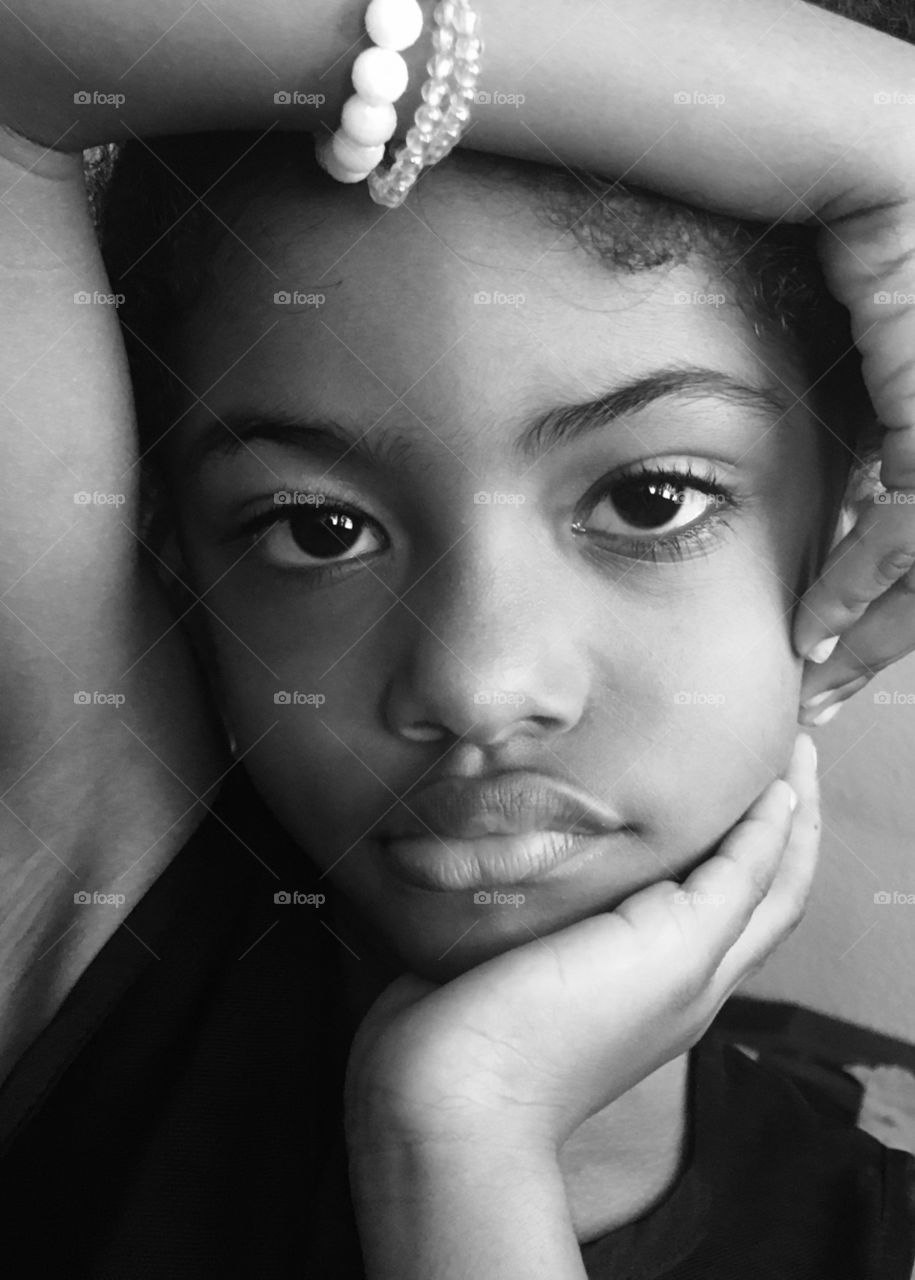 Portrait of african girl with hand on her head