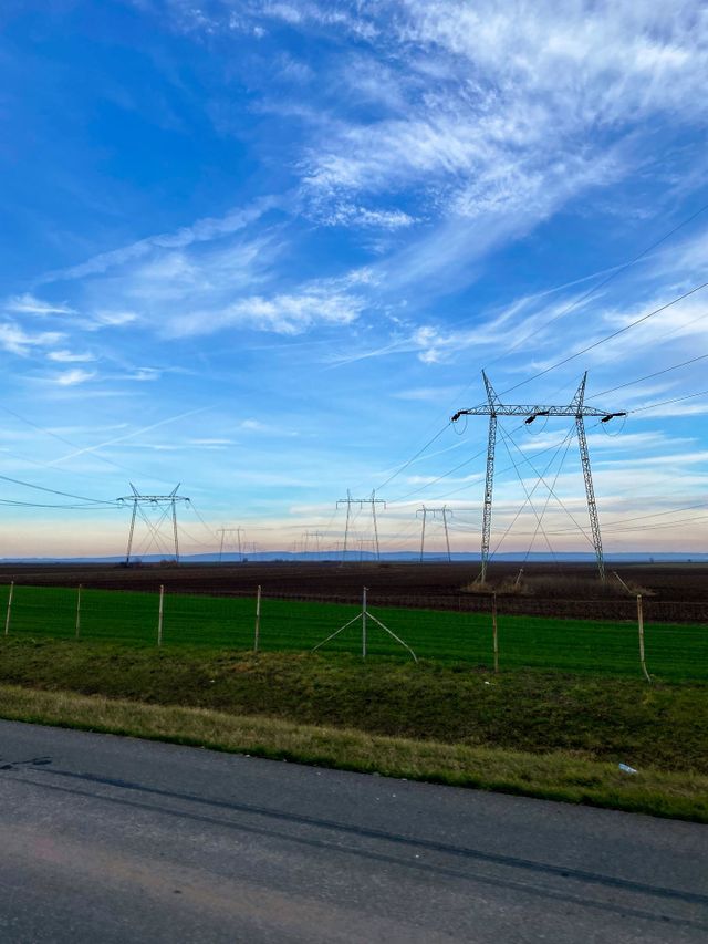 Beautiful view of the fields and power lines on the highway to Novi Sad . 