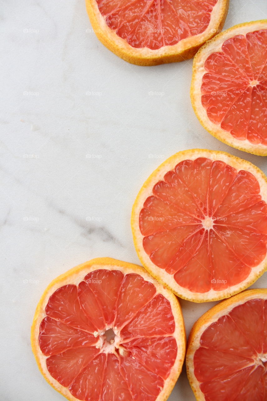 Juicy slices of fresh ruby grapefruit