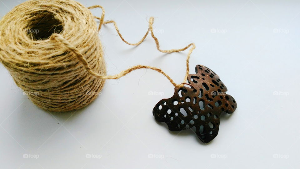 pendant butterfly from coconut on a white background