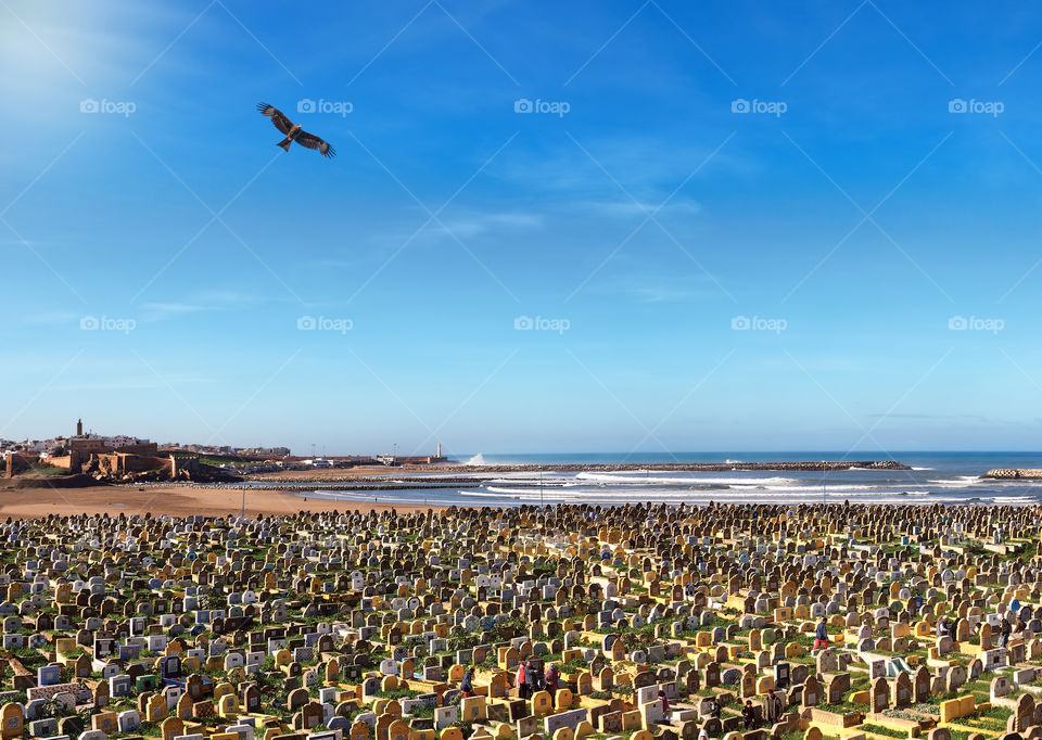 Cemetery in the city of Sale (Morocco) on the coast of the Atlantic Ocean against the background of boundless open space and bottomless blue sky