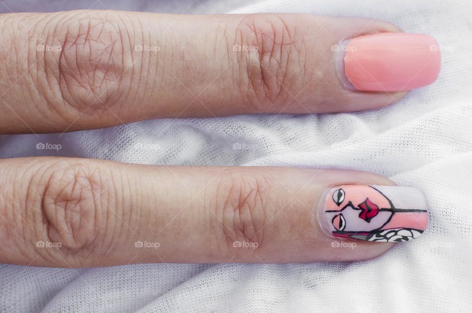 Finger nails with art painted manicure