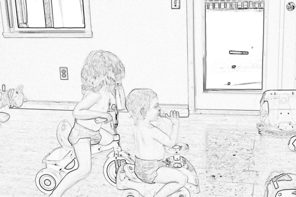 Kids playing riding trikes 