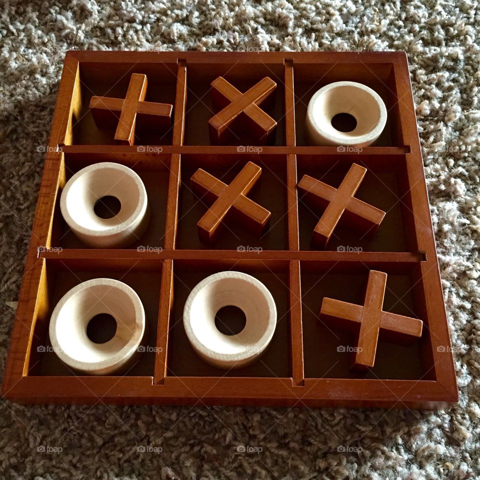 My youngest son loves tic tac toe. This wooden board game is perfect