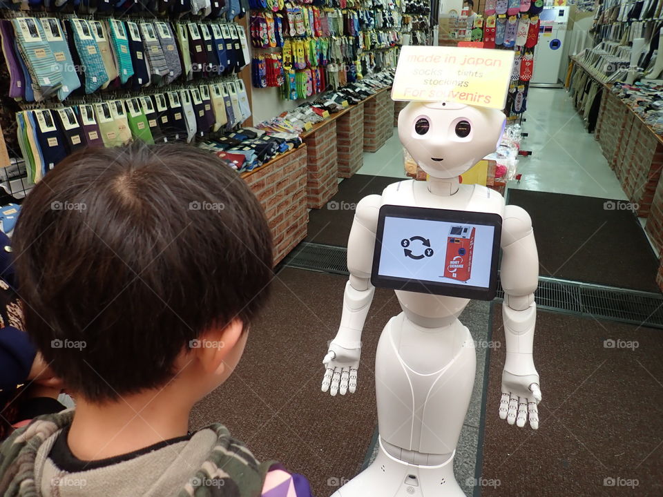 Child interacting with robot