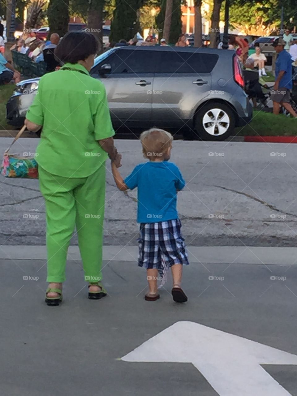 My grandmother and nephew walking hand in hand
