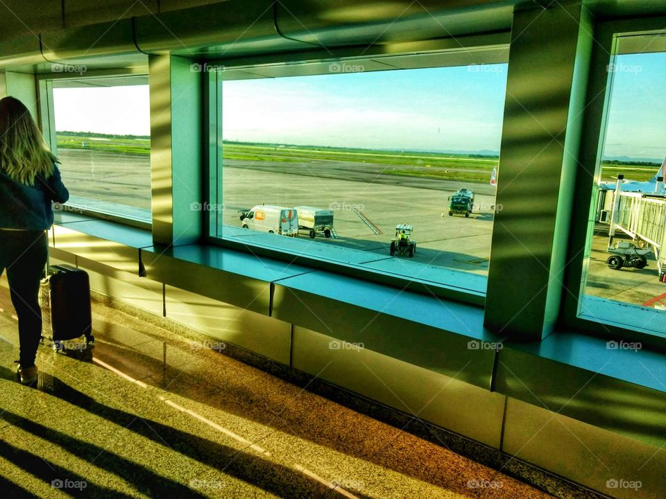 rectangular windows, panoramic in the airport, so you can watch the arrival and departure of planes.