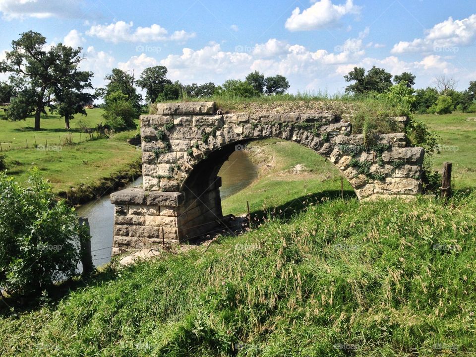 Remains of stone arch railroad bridge. 