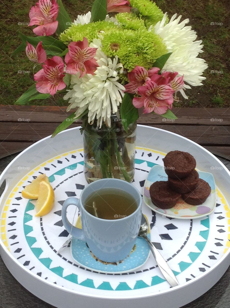 Having a cup of tea outdoors enjoying the beautiful Spring weather.