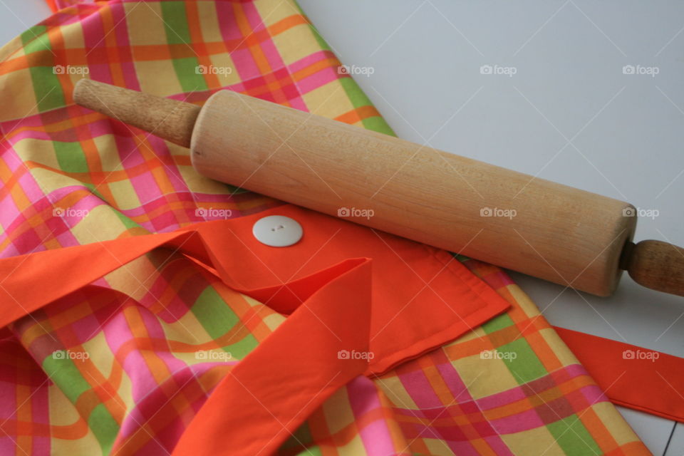 Handmade apron and a rolling pin. 