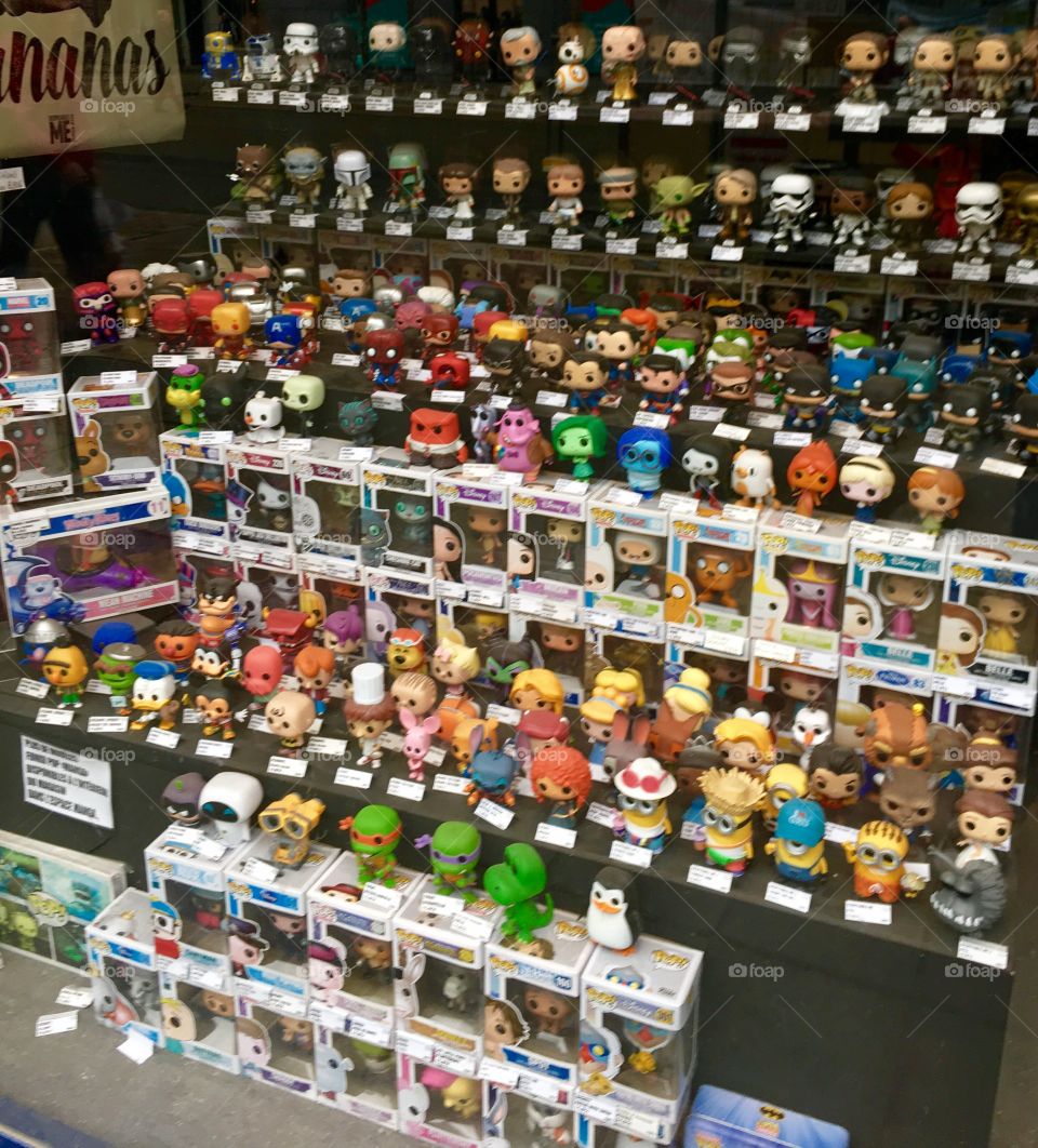 A display case of many Pop figurines, taken while shopping in Brussels, the cartoon capital of Europe 