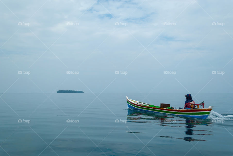 a man sailing boat in the sea