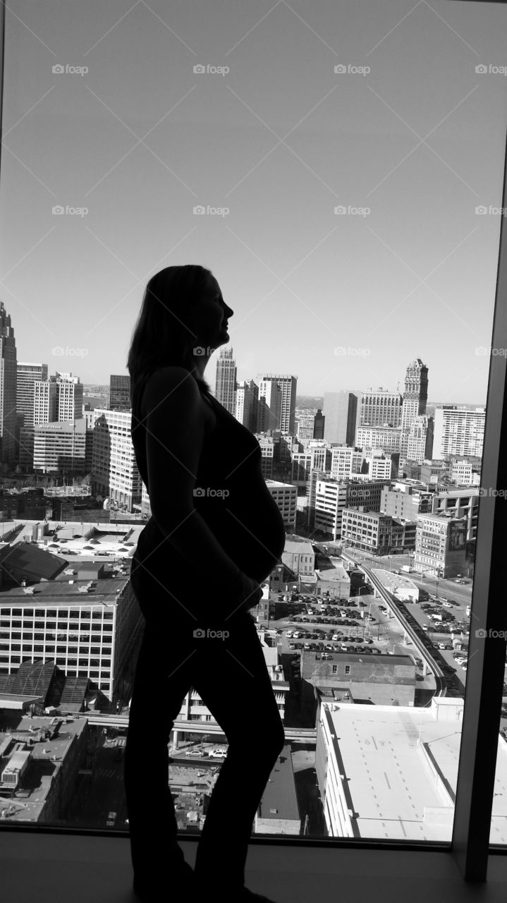 pregnancy silouttes. seven months pregnant on my 30th birthday. got a siloutte shot looking over the city of Detroit, MI.