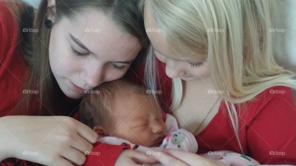 Sibling Love. two of my daughters loving on their new sister
