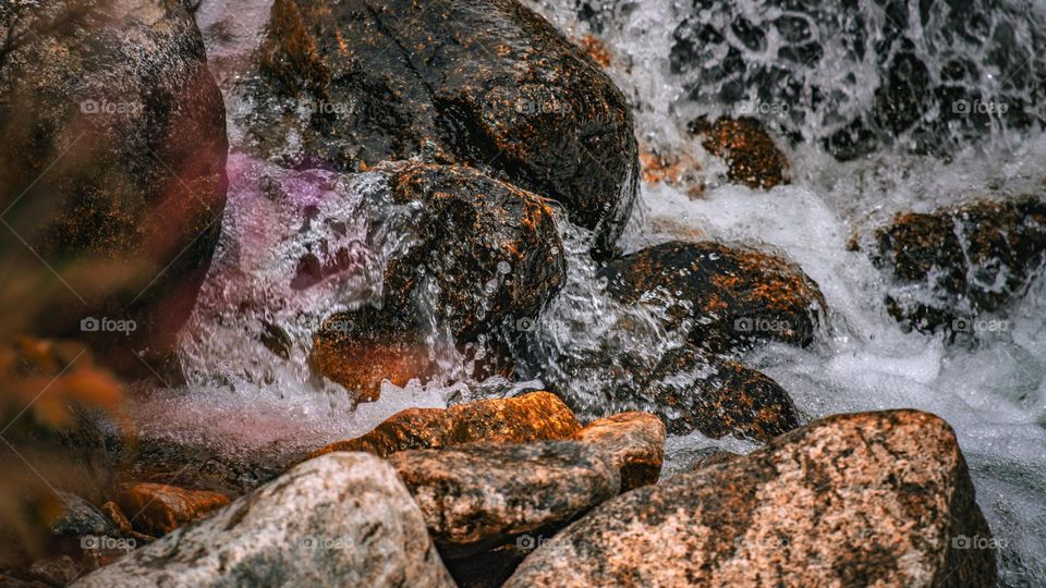 River splashing onto stones.