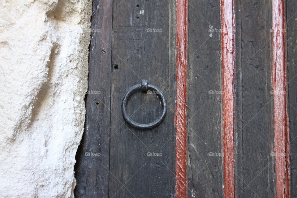 Door knocker . Old wooden door with door knocker 