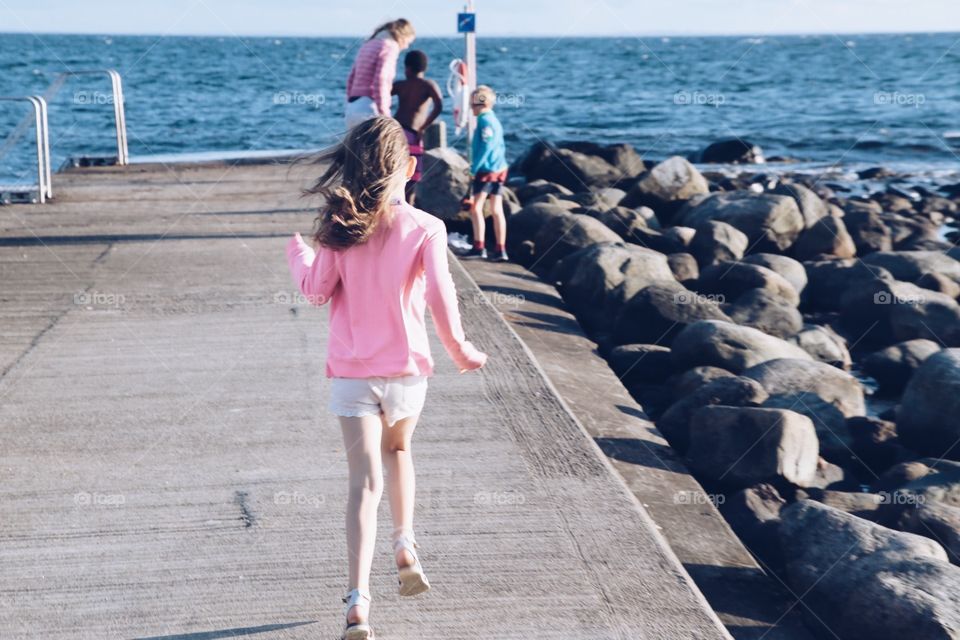 Family on the way to take a swim in the cold ocean