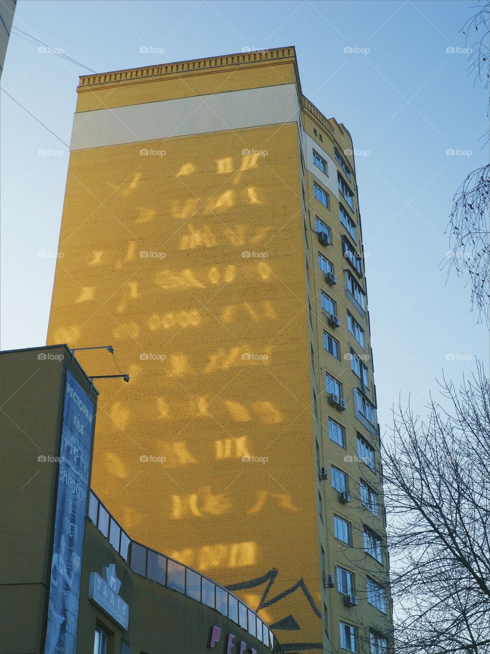 sunlight play on the end of a residential house