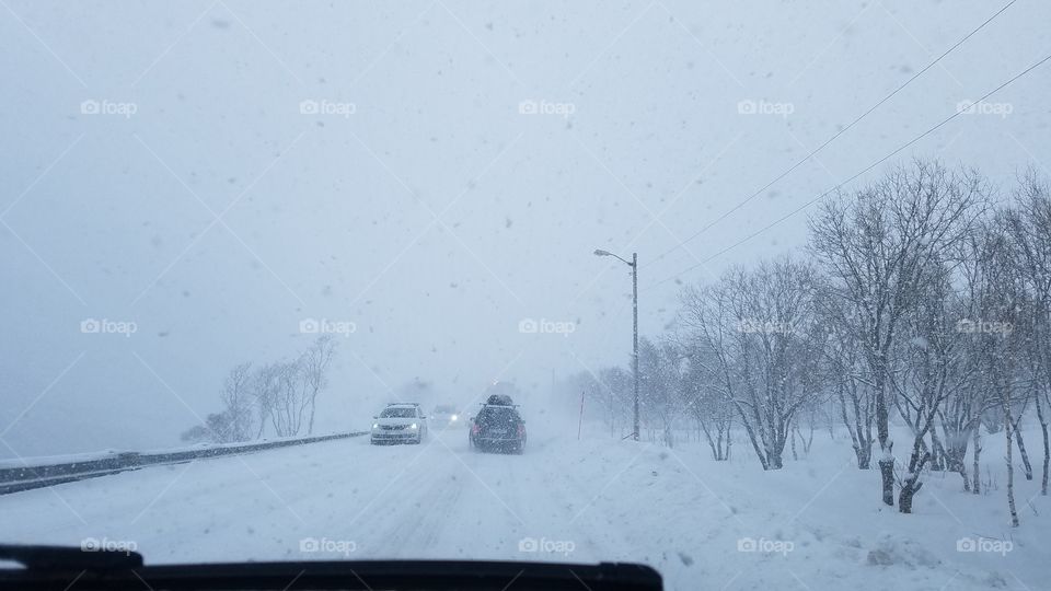 Driving in the snow blizzard