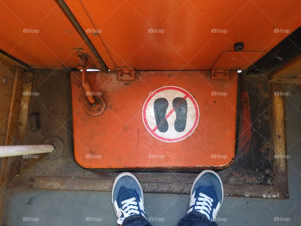 foot on train door