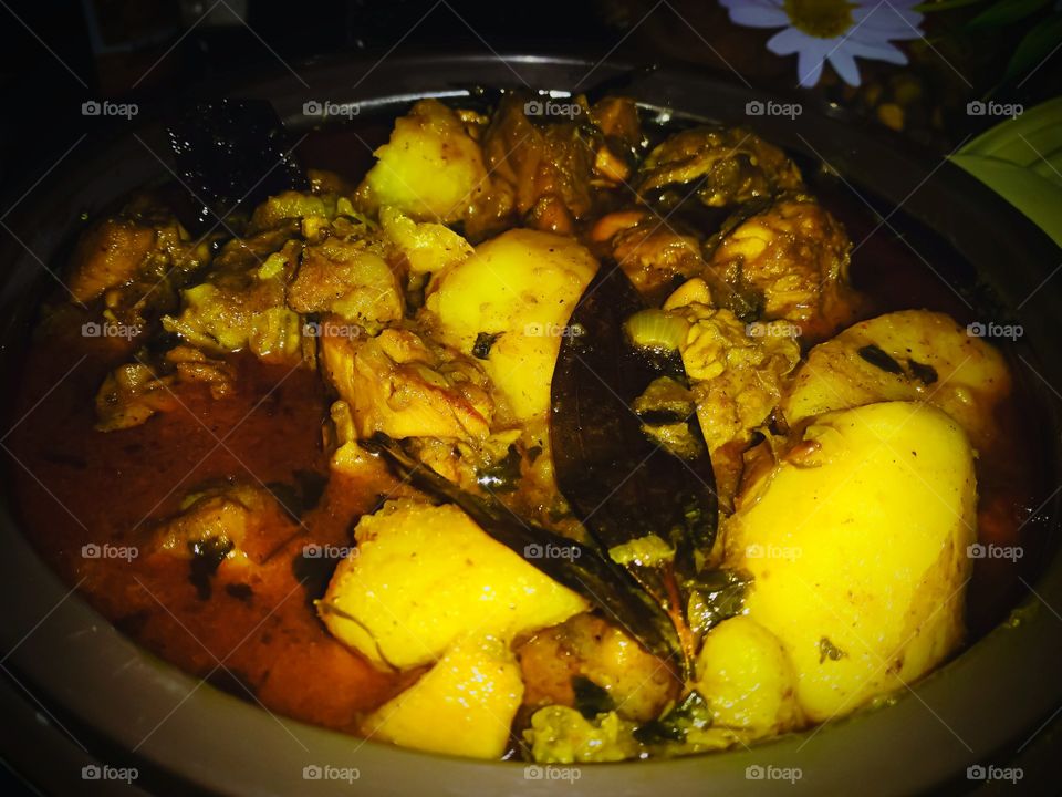 Chicken curry dish in Indian style. Indian dish made for dinner. Non-veg food item served. Chicken Gravy.
