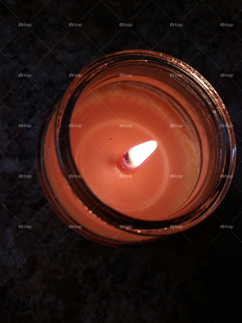 Orange candle illuminating