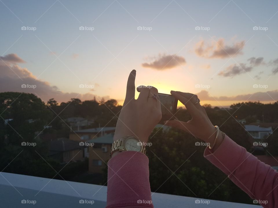 Phone photographer Capturing sunset