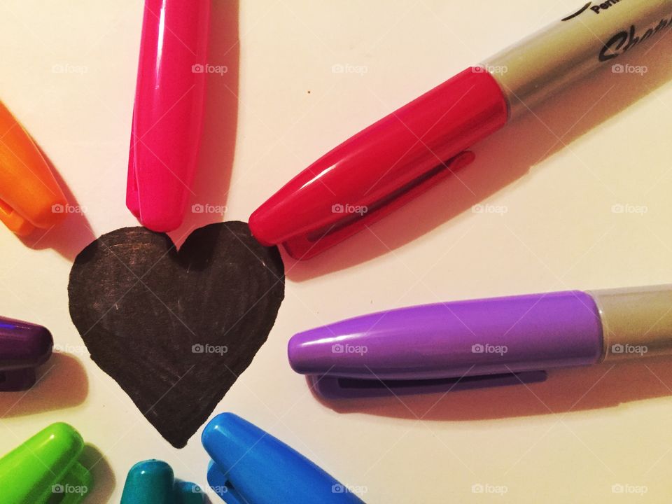 A Close Heart. A closeup of a black heart surrounded by sharpies 