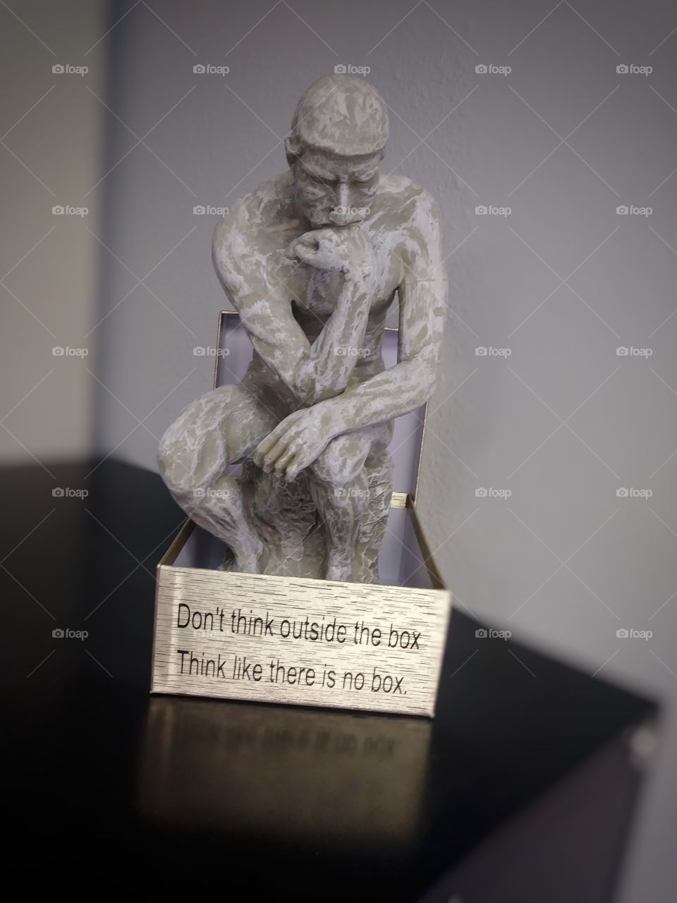 Think as if there is no box desktop sculpture of a man who is thinking.