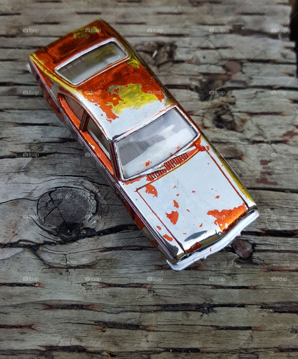 Metallic Orange Old Toy Car
