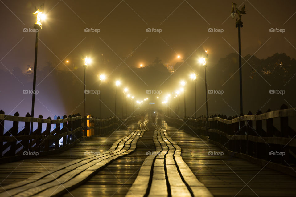 Wood bridge at night in Sagklaburi Kanchanaburi Thailand 