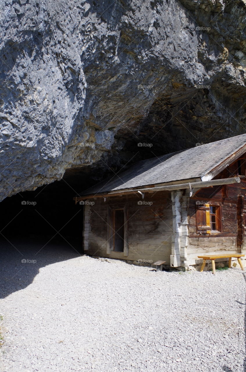 View of wooden house at cave