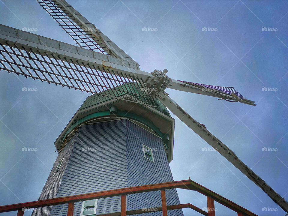 Closeup view looking up at a windmill 